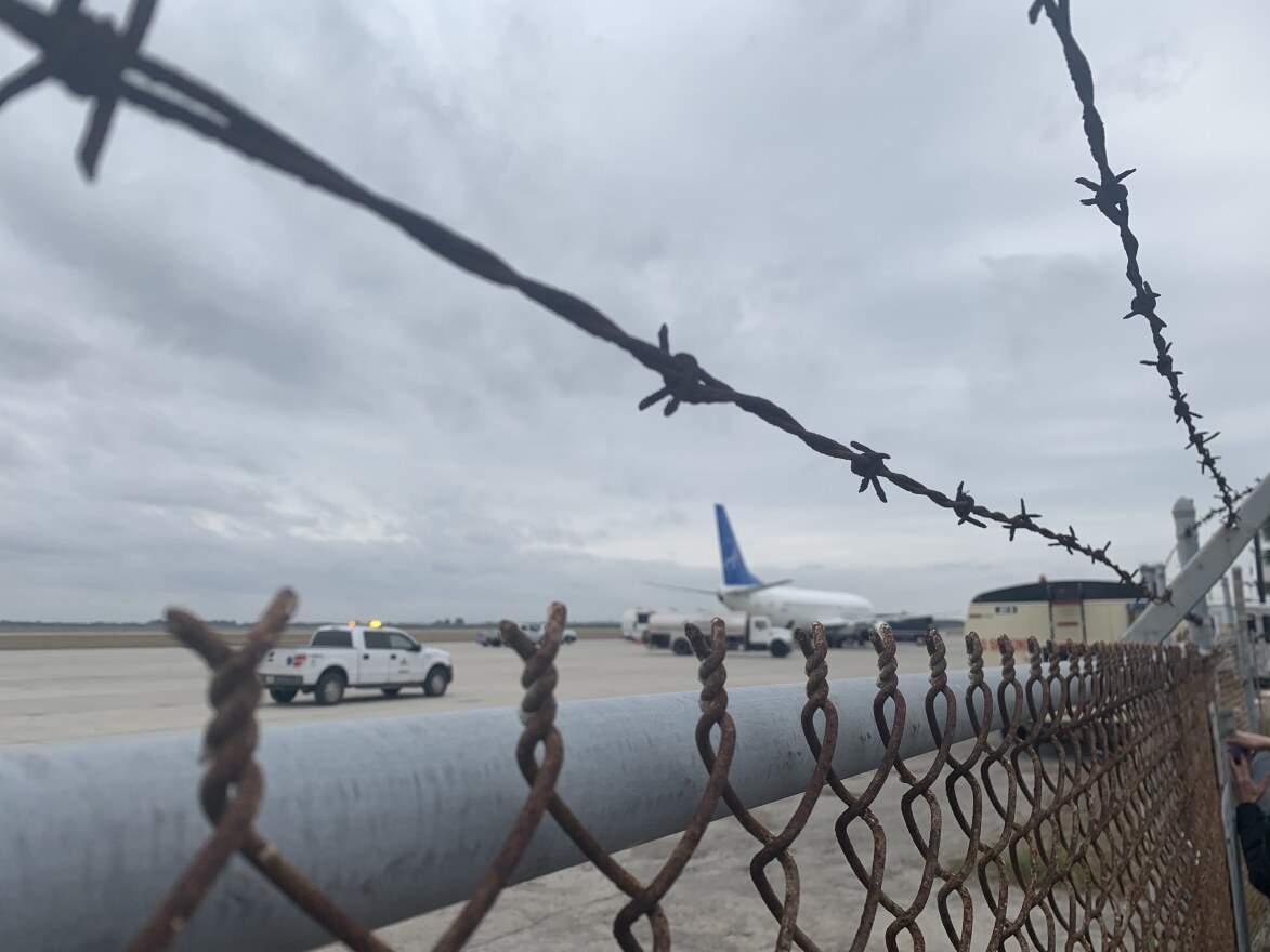 A plane waits on the runway at Brownsville South Padre Island International Airport.